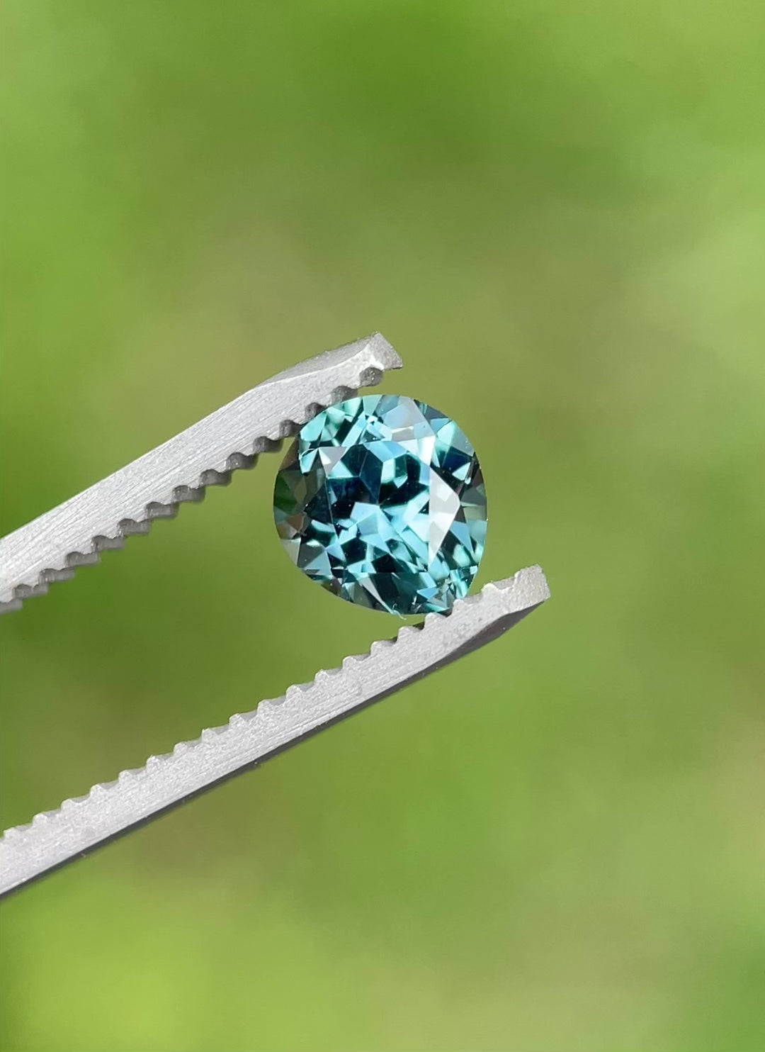360-degree rotation of a 1.02 carat heated Montana sapphire with teal and blue brilliance, modified pear cut.