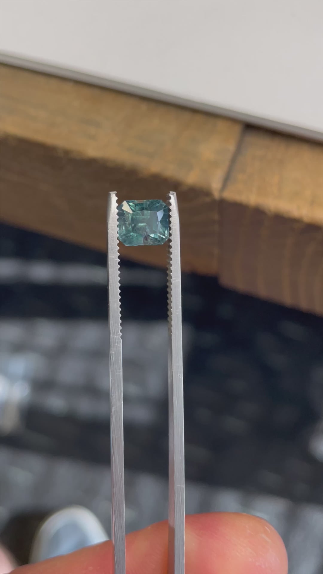 Rotating video of a 2.50-carat Montana sapphire in Asscher cut revealing its vivid teal, blue, and green brilliance.