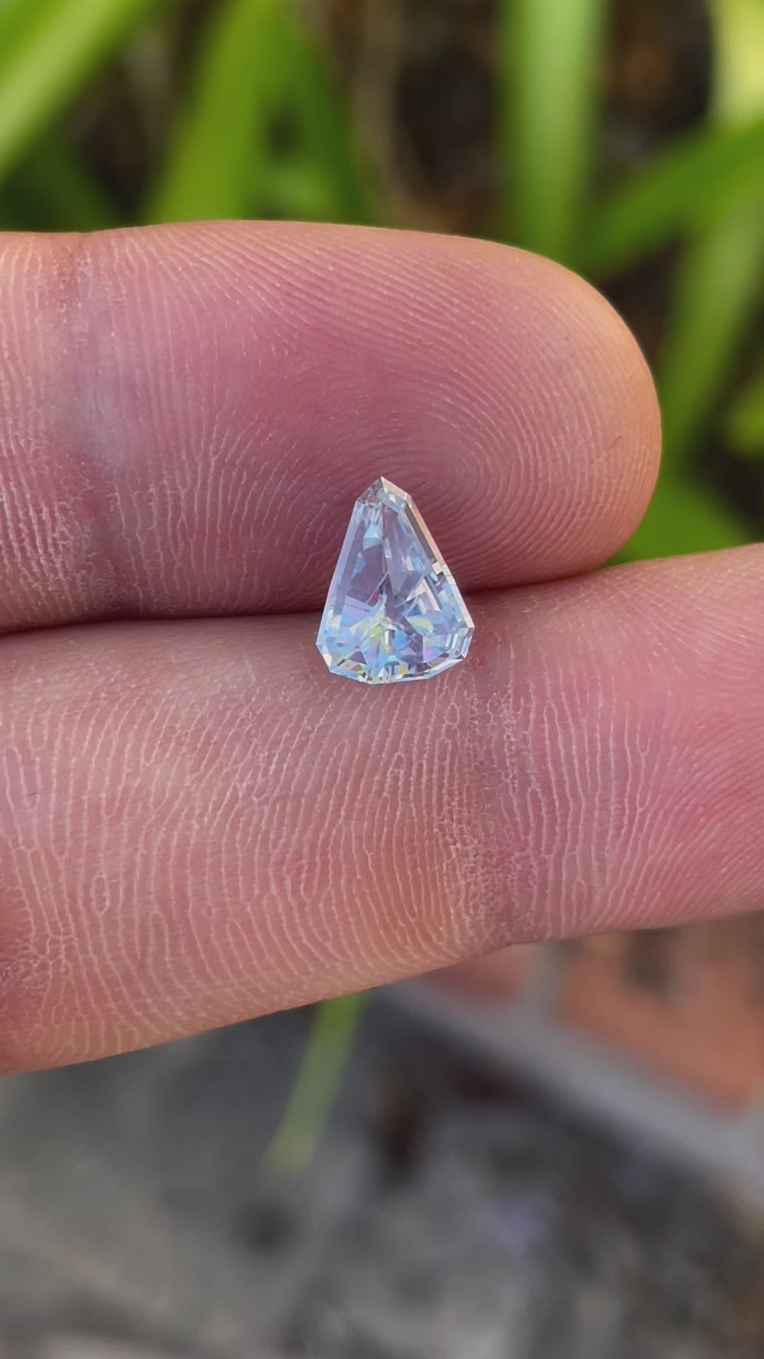 Detailed view of Light Ceylon Gray Blue Sapphire, Custom Shield Cut, 1.98 Carats, 9.92 x 7.81 x 3.96 mm, Sri Lankan Origin, No Heat Treatment, Priced at $1980.00
