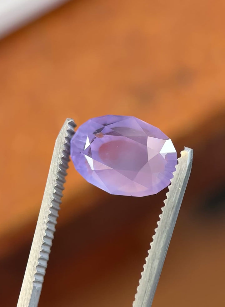 Close-up video of lavender purple sapphire highlighting muted brilliance and antique style cut.