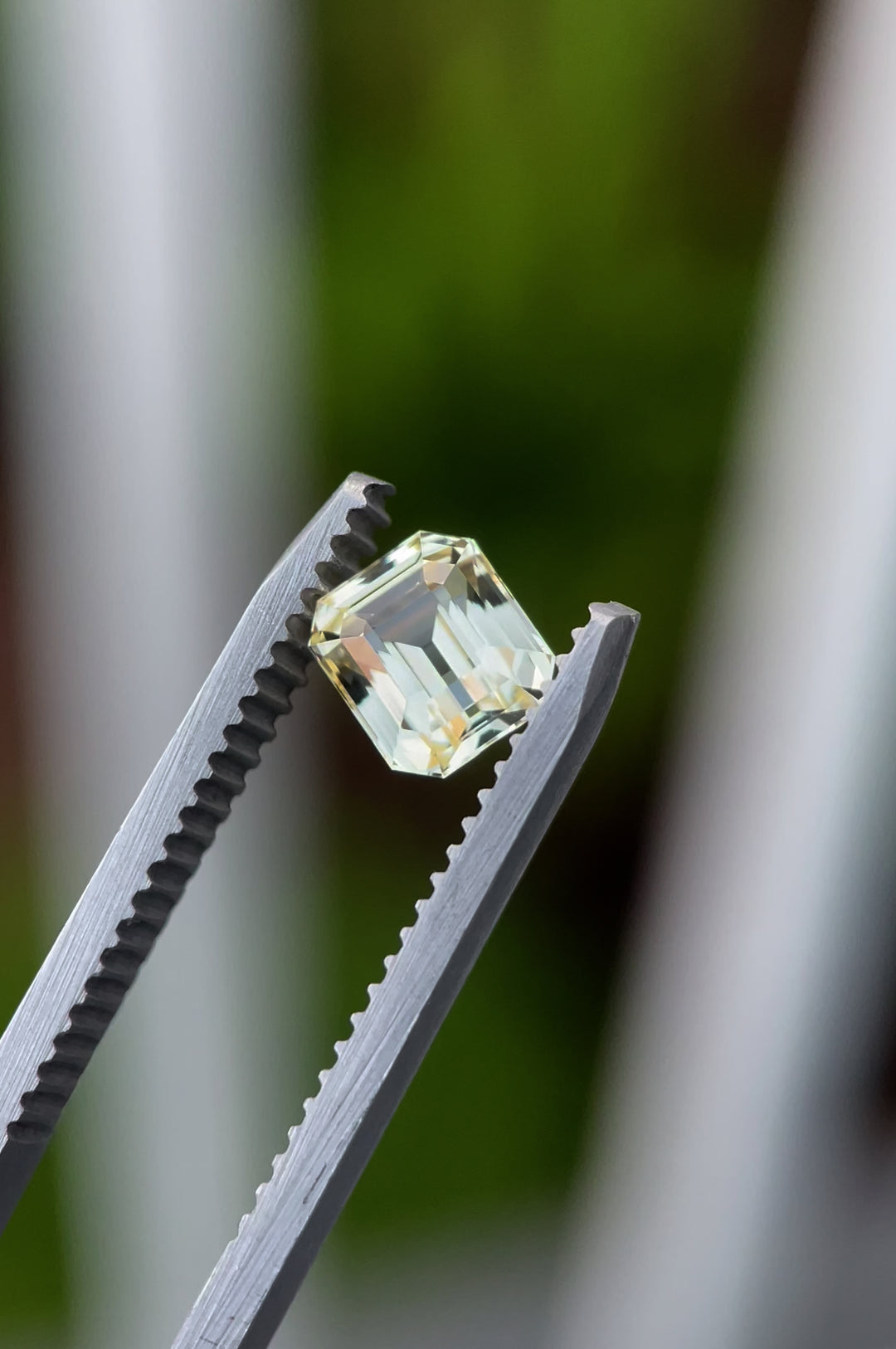 A close-up video of the pastel canary yellow sapphire, showcasing its 1.43-carat weight, octagonal step cut, and pristine clarity. The gem sparkles vividly as light dances across its facets, emphasizing its radiant pastel yellow tone.