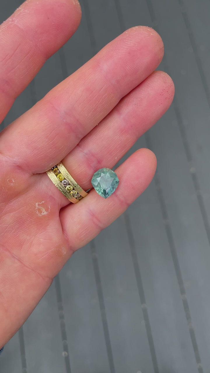 Rotating video of untreated Montana sapphire, 7.08 carats, revealing its precision pear cut and vibrant color mix.