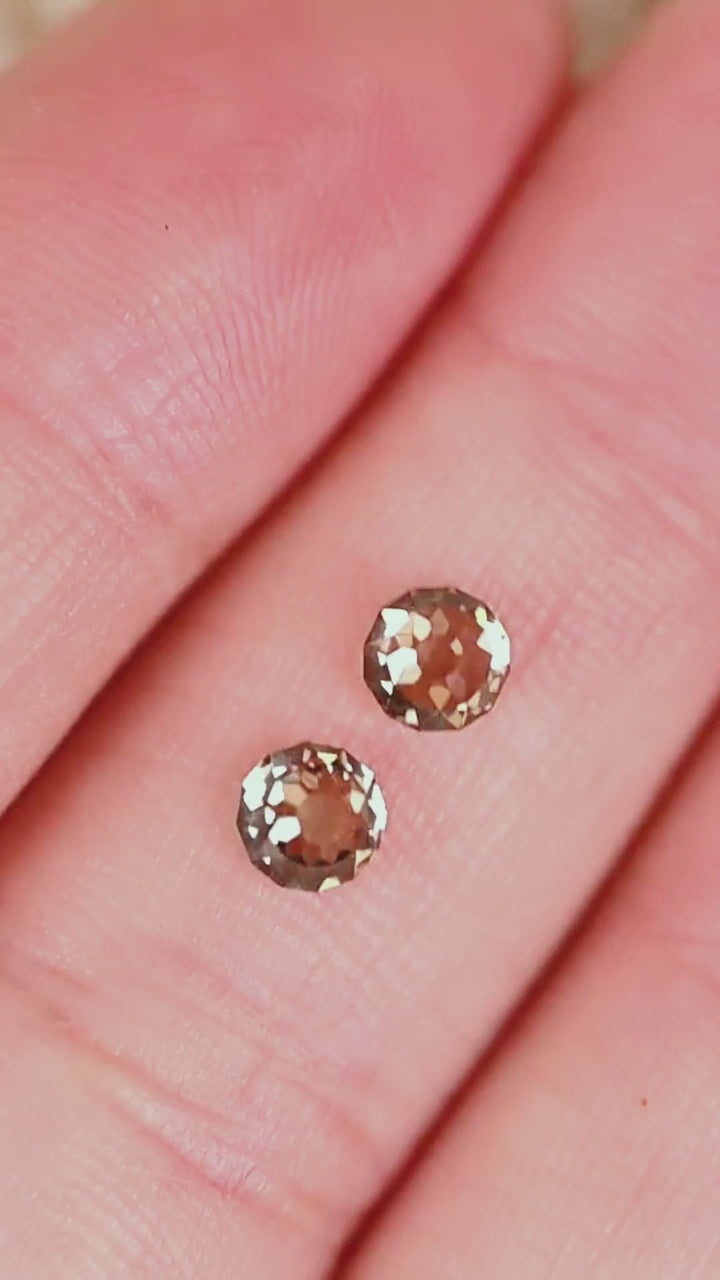Explore a complementary pair of Round Mughal cut diamonds from South Africa, weighing 1.32 carats total. Their C1–C3 champagne coloration ranges from pale silvery beige to deeper smoky brown, while distinctive geometric facets create broad flashes of reflected light. With VVS2 clarity and no treatment, these diamonds offer an antique-inspired alternative for bespoke earrings and fine jewelry.