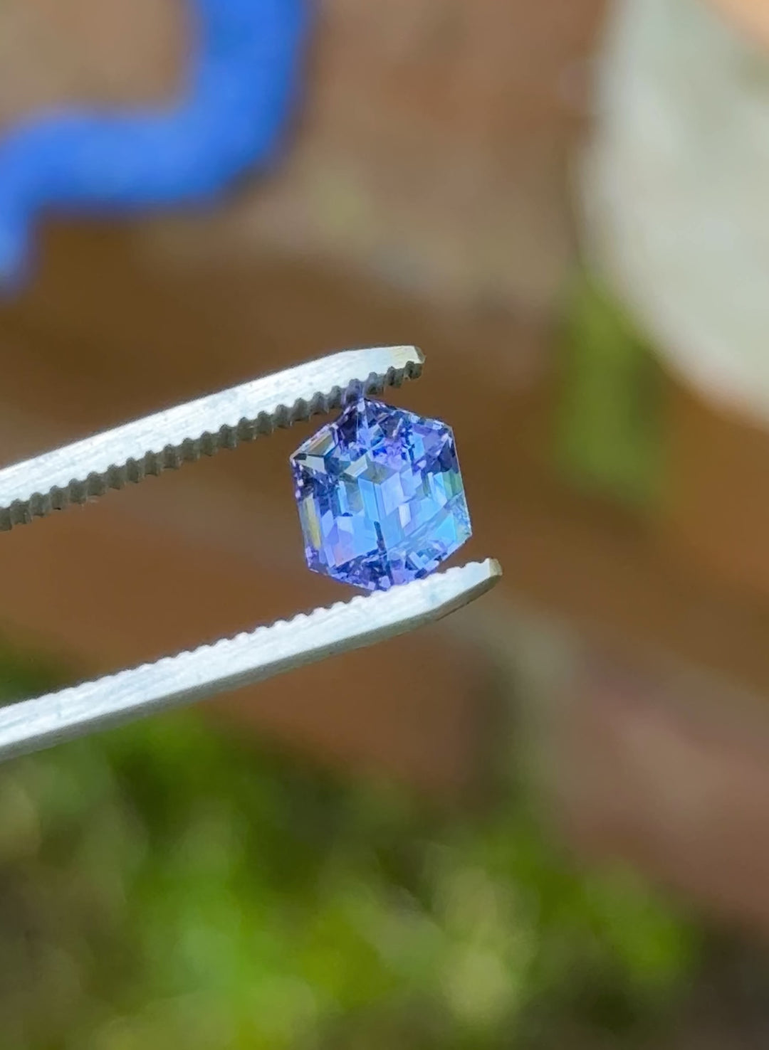 360-degree video of a 2.28ct Tanzanite hexagon gemstone highlighting its geometric step cut and unheated teal-violet color blend.