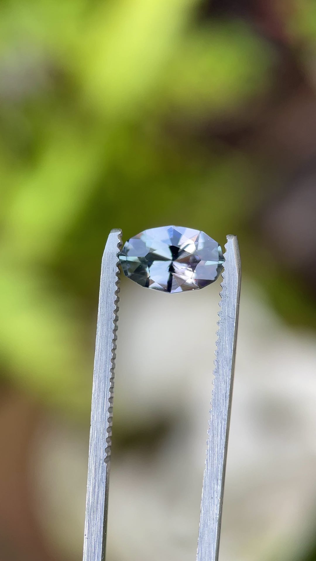 Video of a 1.78-carat Tanzanite rotating to reveal its teal, green, lavender, and mermaid flashes, cut in a custom geometric oval.