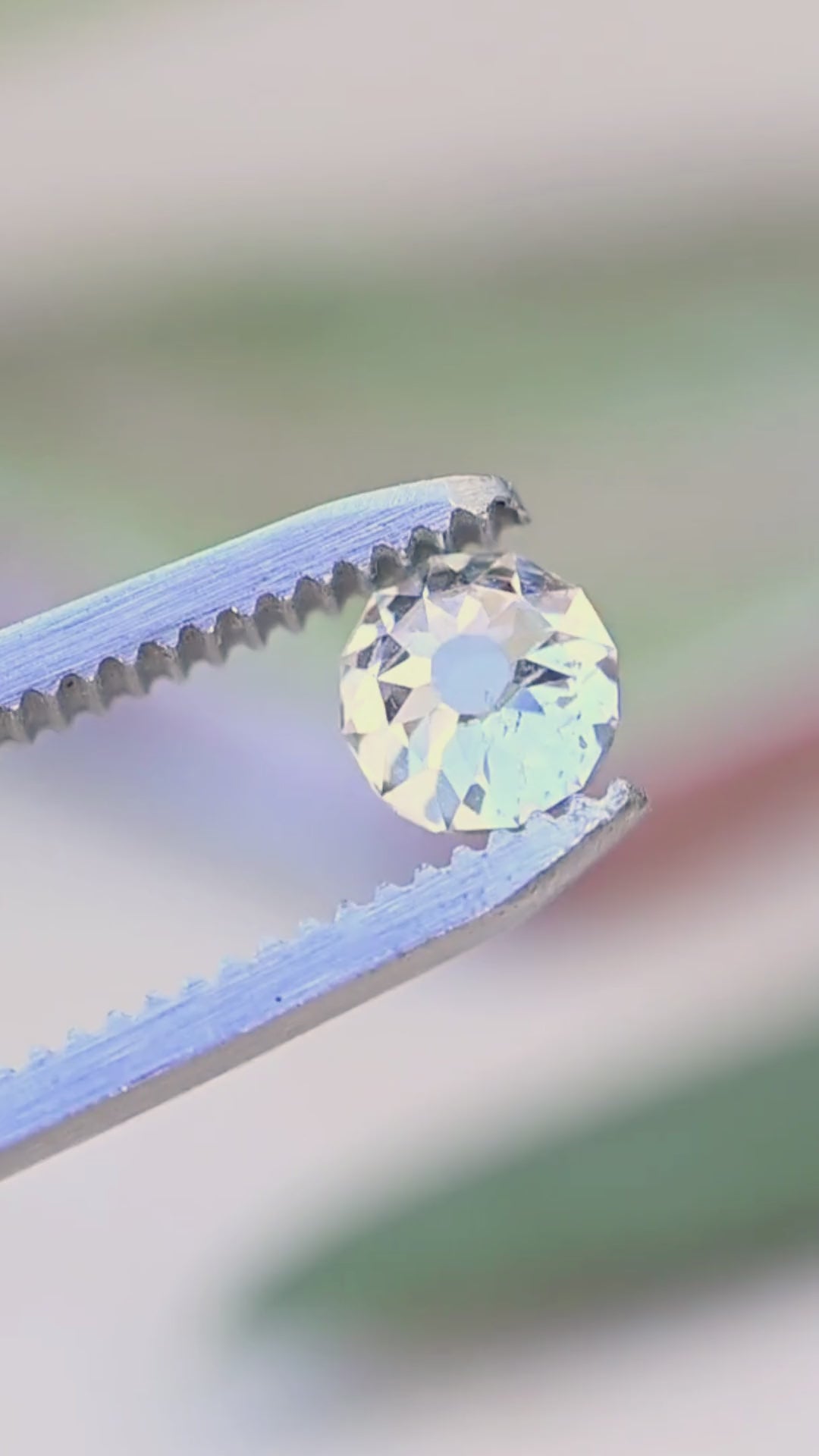 1.01 carat Mughal cut diamond rotated between jeweler’s tweezers, showing the relationship between its radial face-up facet pattern and gently domed profile.