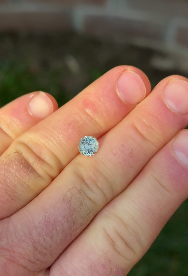Portuguese cut sapphire from Montana – 360° view of earthy mint green gem under natural light