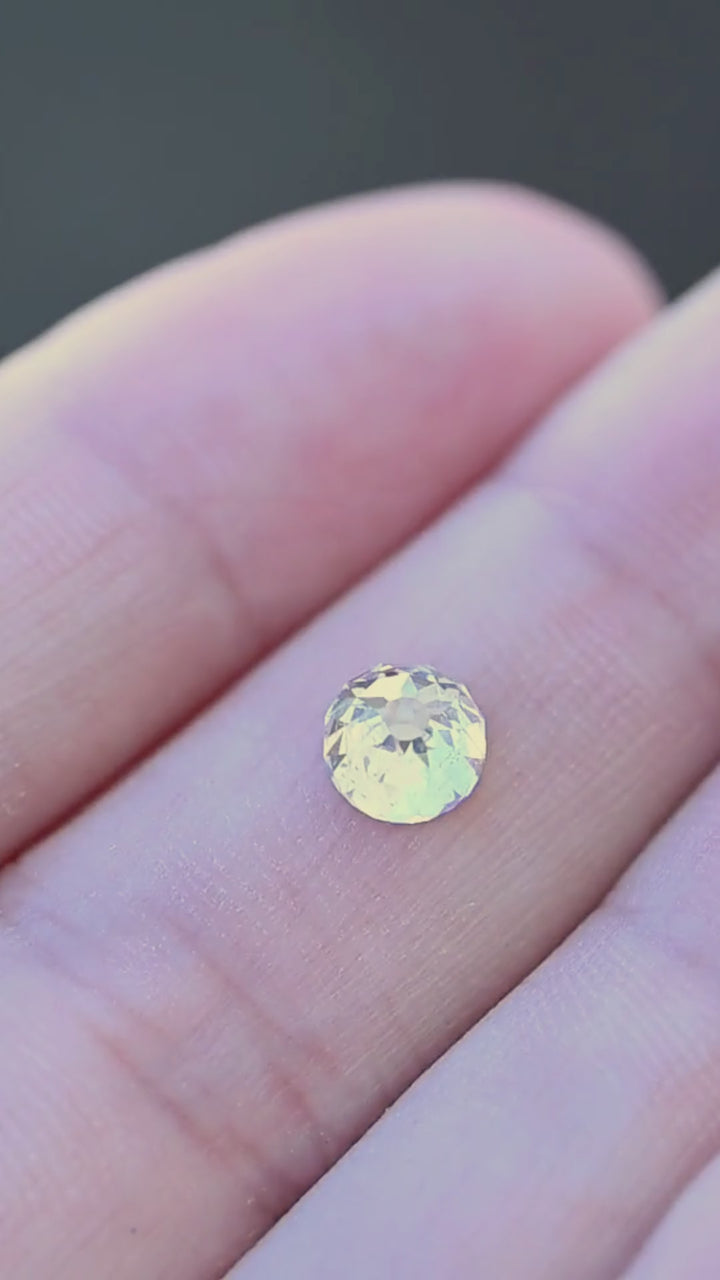1.01 carat South African Mughal cut diamond shown moving on a hand, revealing its scale, natural inclusions and shifting flashes of white, champagne and reflected color.