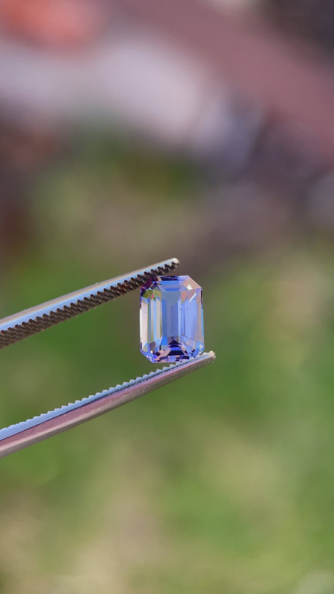 Video of a Precision Emerald Cut Tanzanite Gemstone in Teal Blue and Purple Colors, Weighing 1.70 Carats, with Dimensions 8.49 x 5.85 x 3.98 mm, Originating from Merelani Hills, Arusha Region, Tanzania - No Treatment