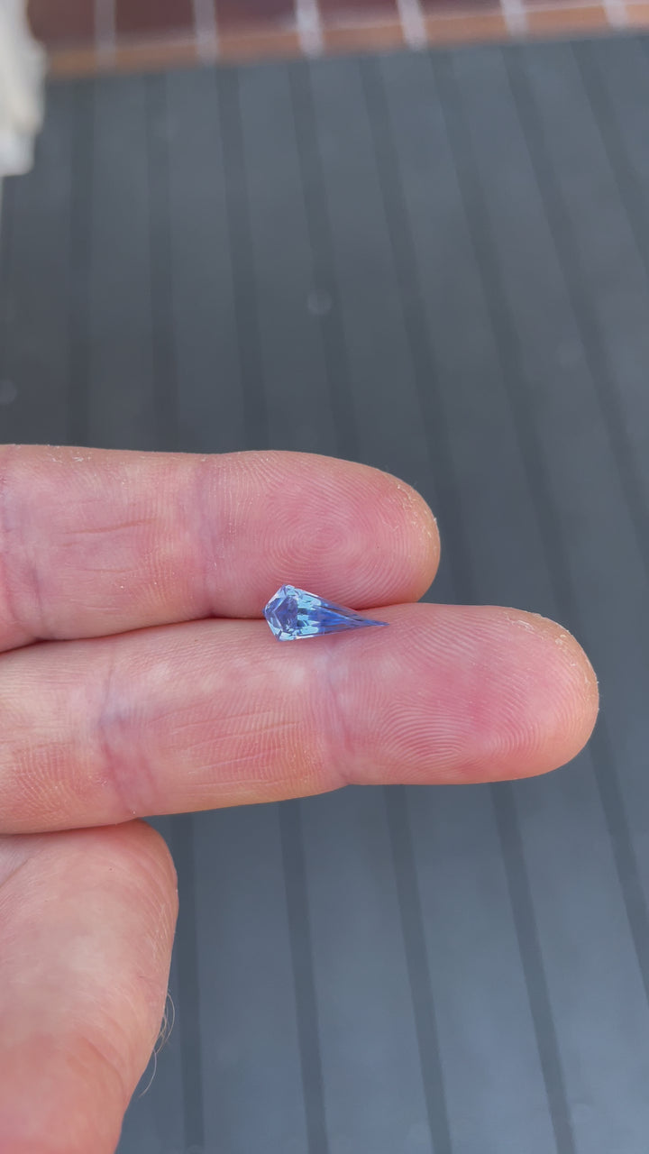 A video capturing the elegant kite-shaped step cut and vivid powder blue hue of a 1.70-carat sapphire. Untreated and ethically sourced from Sri Lanka, this gemstone exudes charm.