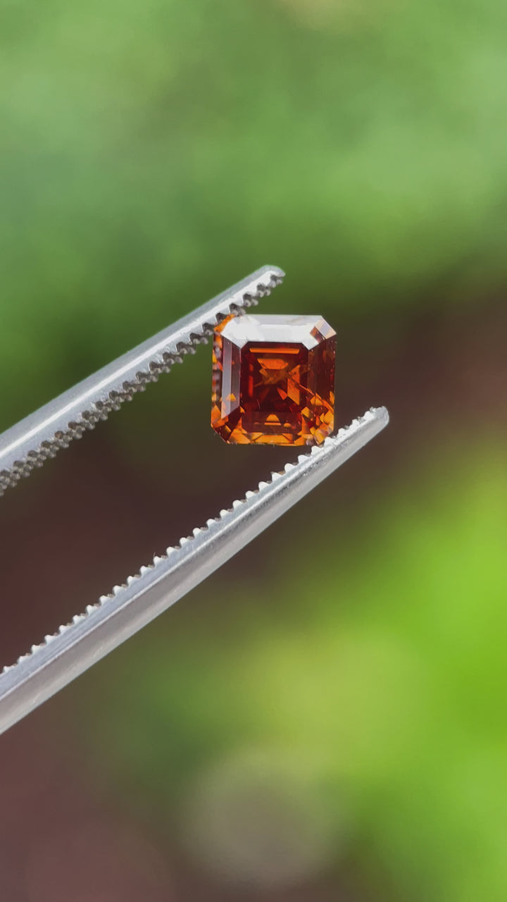 High-definition video of a 1.01-carat octagonal step-cut diamond, displaying its fiery brilliance and color transitions under different angles.