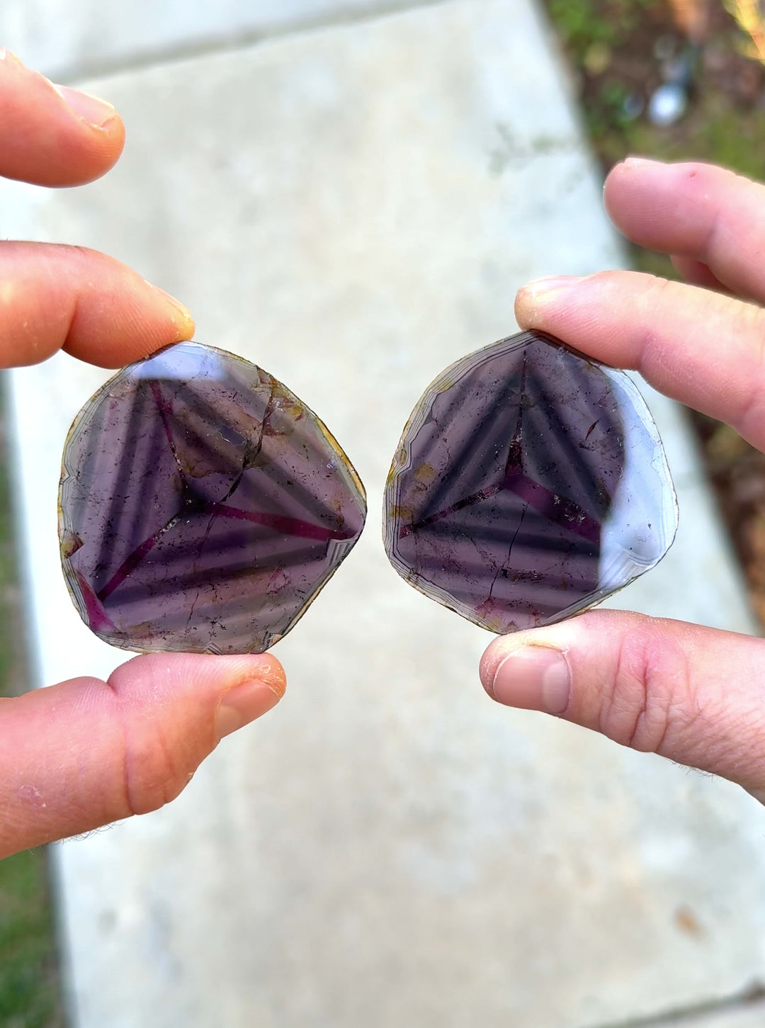 Rotating video of natural 123.90 carat liddicoatite tourmaline sister crystal pair from Madagascar under sunlight, showing internal triangular zoning and layers of pink, blue, and purple hues.