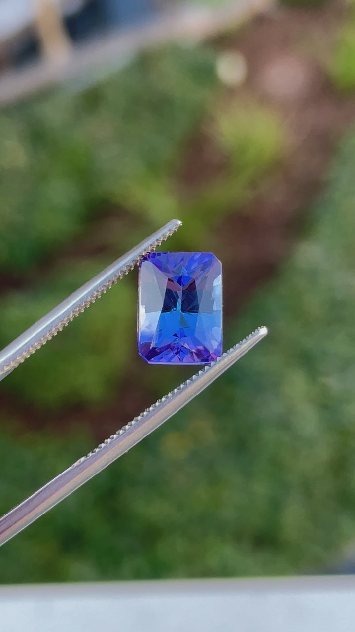 360-degree view of a radiant cut Tanzanite gemstone with vivid blue and ultra violet tones, from Merelani Hills.