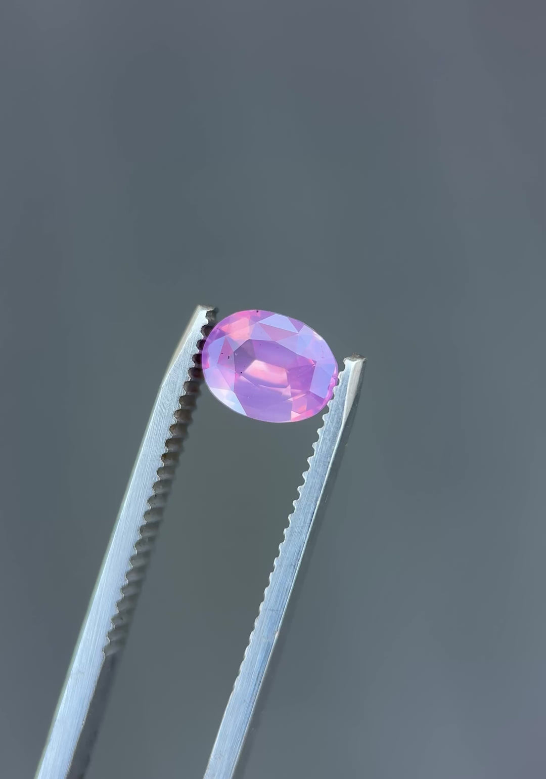 1.52CT Sapphire: Orangish Pink Opalescent Precision Oval Mixed Cut