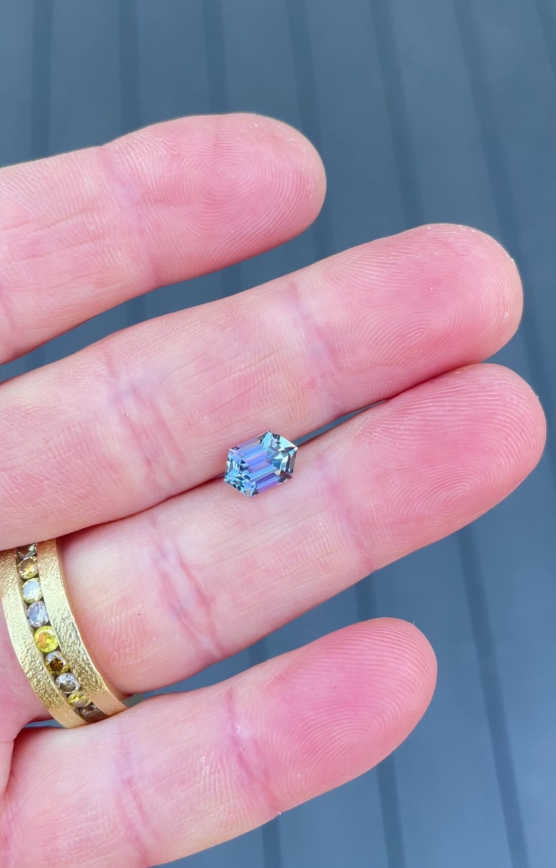 Video showcasing a 1.60-carat Tanzanite from Merelani Hills with brilliant step cut hexagon shape and shifting blue-violet tones