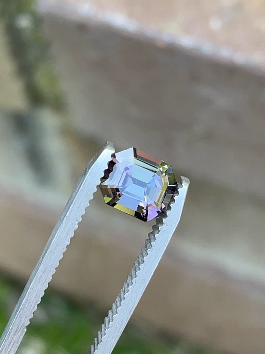 360-degree video of a 1.32 carat Tanzanite in emerald cut, showcasing vivid mermaid hues of teal, purple, and blue from Merelani Hills, Tanzania.