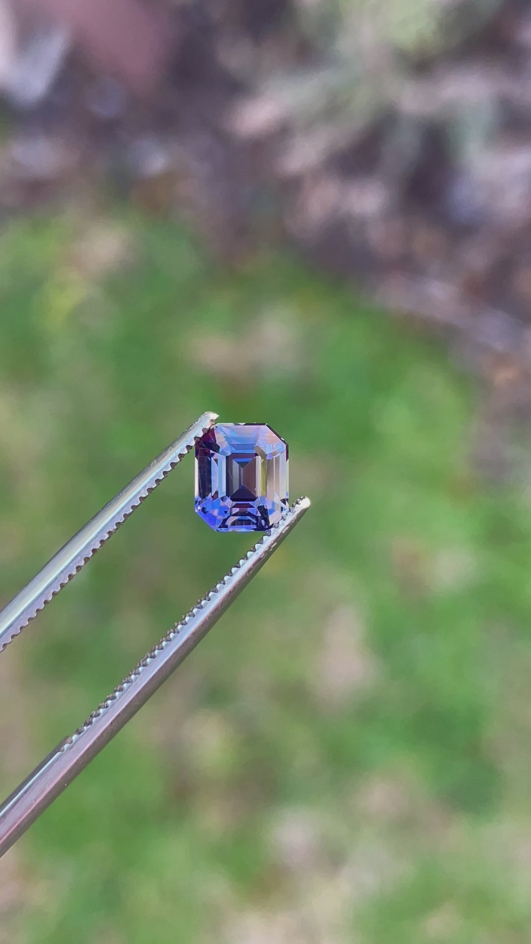 Video of a Custom Modified Emerald Cut Tanzanite Gemstone in Teal, Blue, Green, and Purple Colors, Weighing 1.32 Carats, with Dimensions 6.49 x 5.58 x 4.60 mm, from Merelani Hills, Arusha Region, Tanzania - No Treatment