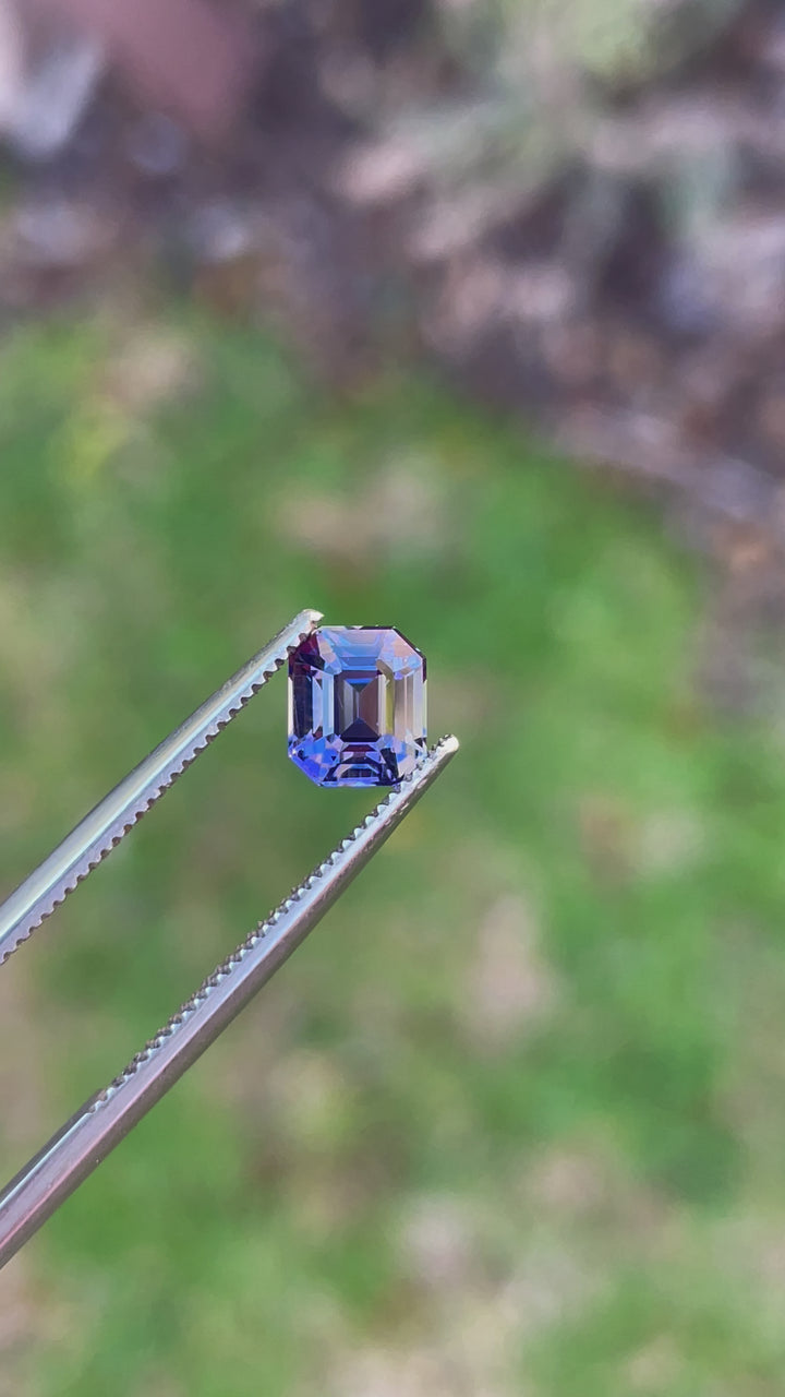 Video of a Custom Modified Emerald Cut Tanzanite Gemstone in Teal, Blue, Green, and Purple Colors, Weighing 1.32 Carats, with Dimensions 6.49 x 5.58 x 4.60 mm, from Merelani Hills, Arusha Region, Tanzania - No Treatment