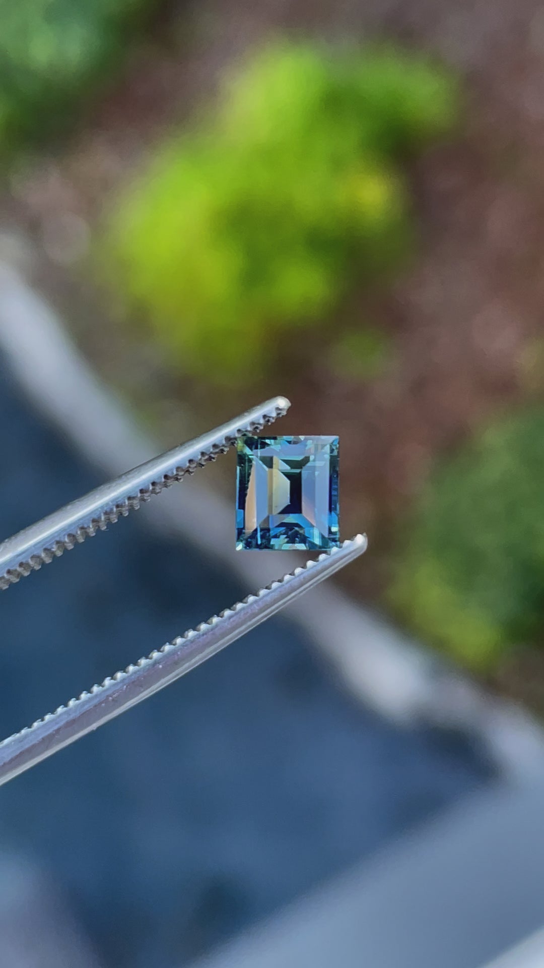 Video of a 1.03ct bi-color sapphire from Madagascar, showcasing its exceptional clarity and color shift under light.