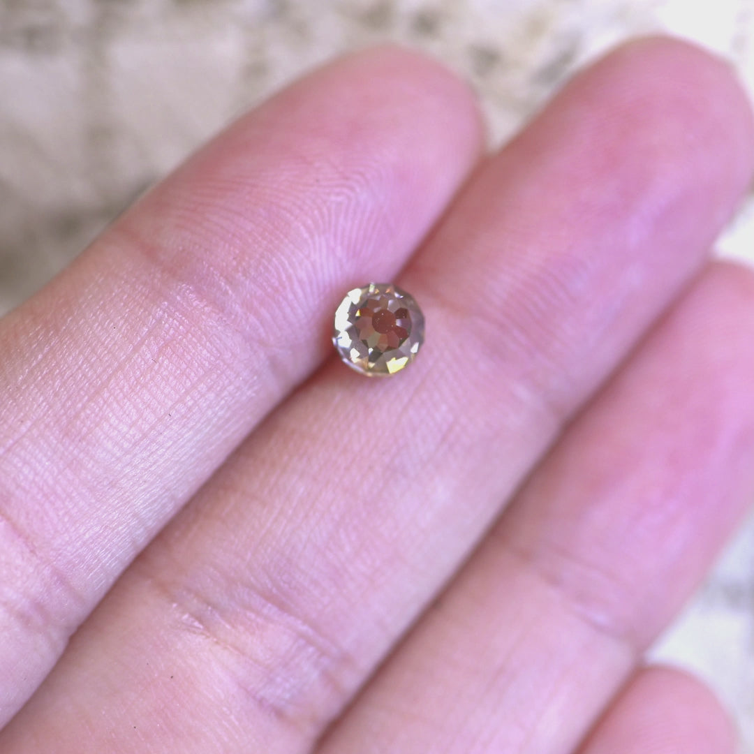 Rotating loose fancy yellow brown Mughal cut diamond from South Africa, revealing its warm brilliance and distinctive Mughal faceting in changing light.