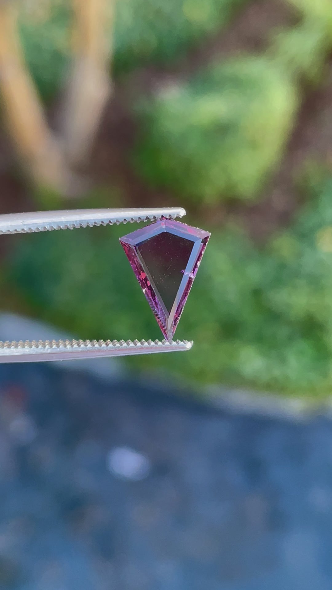 360-degree video of a 1.44 carat spinel gemstone with a custom kite step cut, displaying purple and pink hues, untreated, and from Sri Lanka.