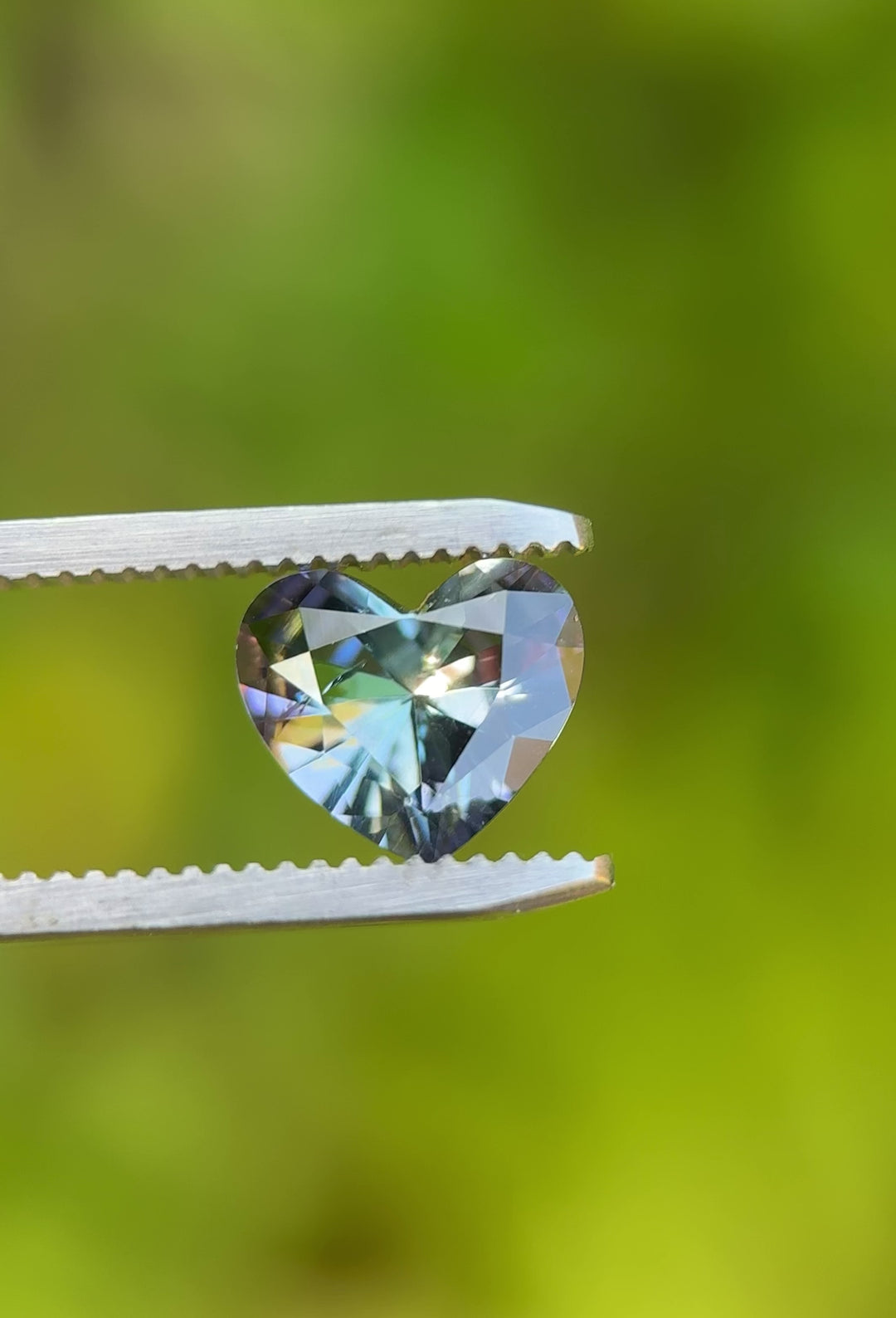 Close-up video of Merelani Hills Tanzanite displaying brilliant blue, green, and purple hues in heart-shaped cut