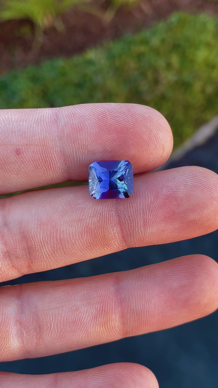 A 360-degree video showcasing the brilliance of a 7.24-carat steel blue and ultra violet tanzanite gemstone in radiant cut.