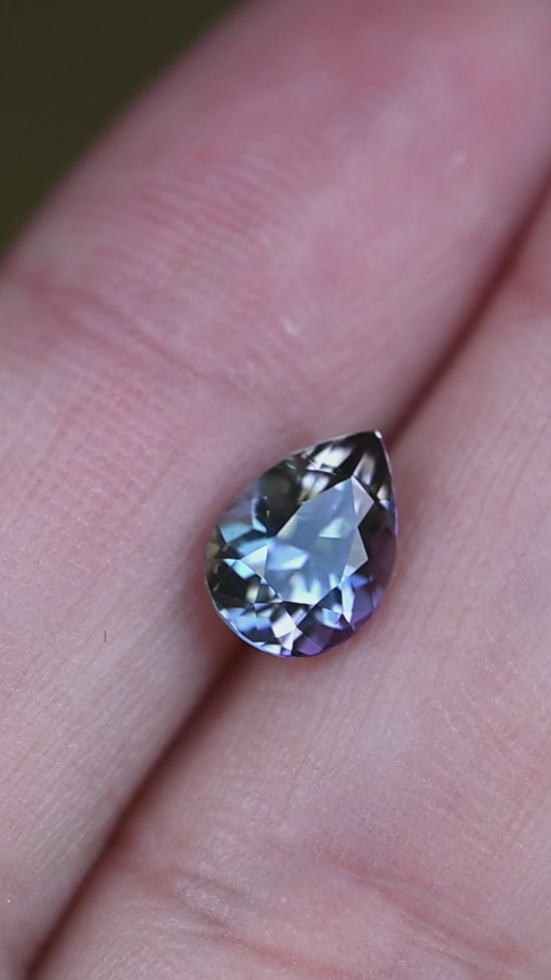 Experience the remarkable natural pleochroism of this untreated Merelani tanzanite as its expertly cut pear shape displays shifting mermaid hues from every viewing angle.