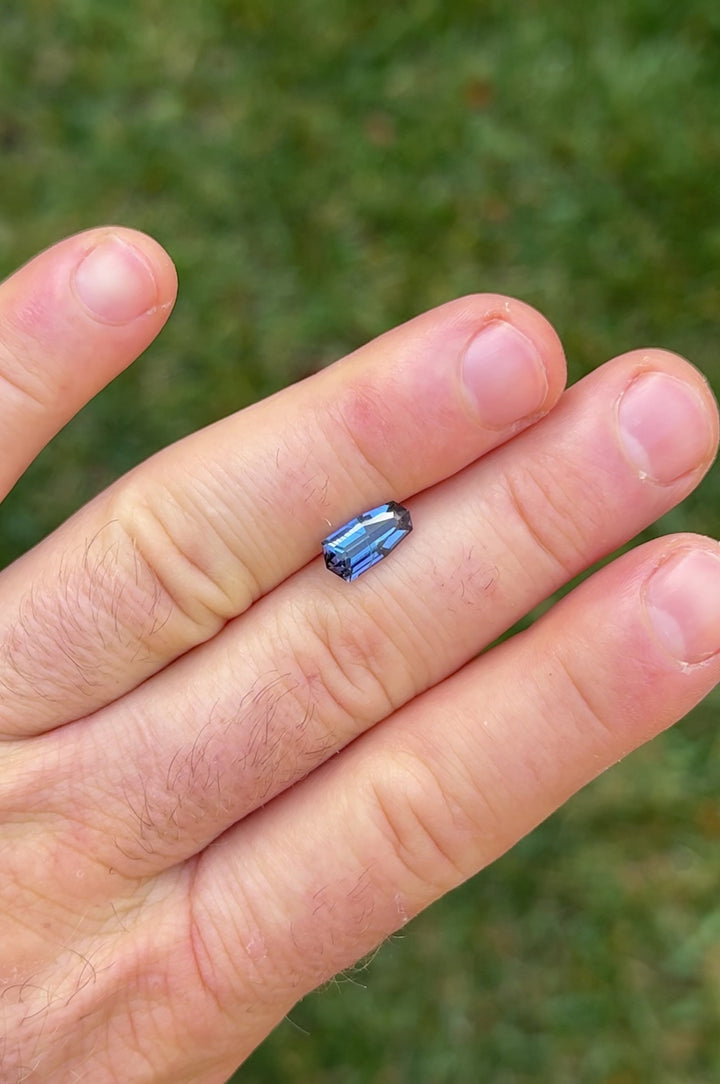 360-degree video of a 2.13ct shield step cut tanzanite with teal, purple, and blue tones; shows high brilliance and clean cut.